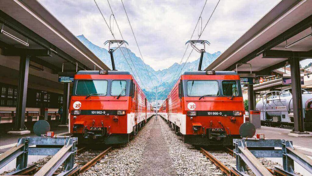 Two red trams at the tram station