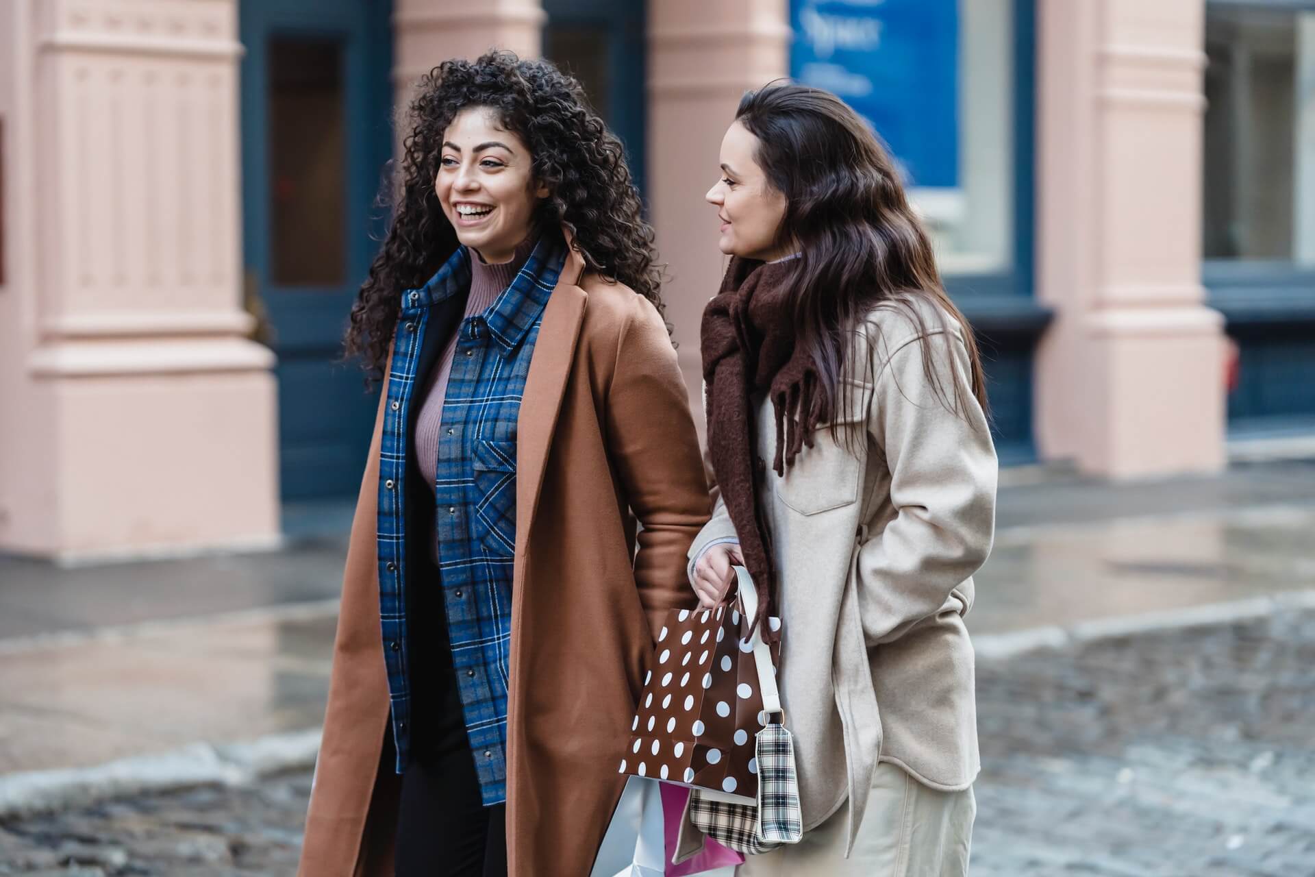 Multiracial friends walking on a street. 