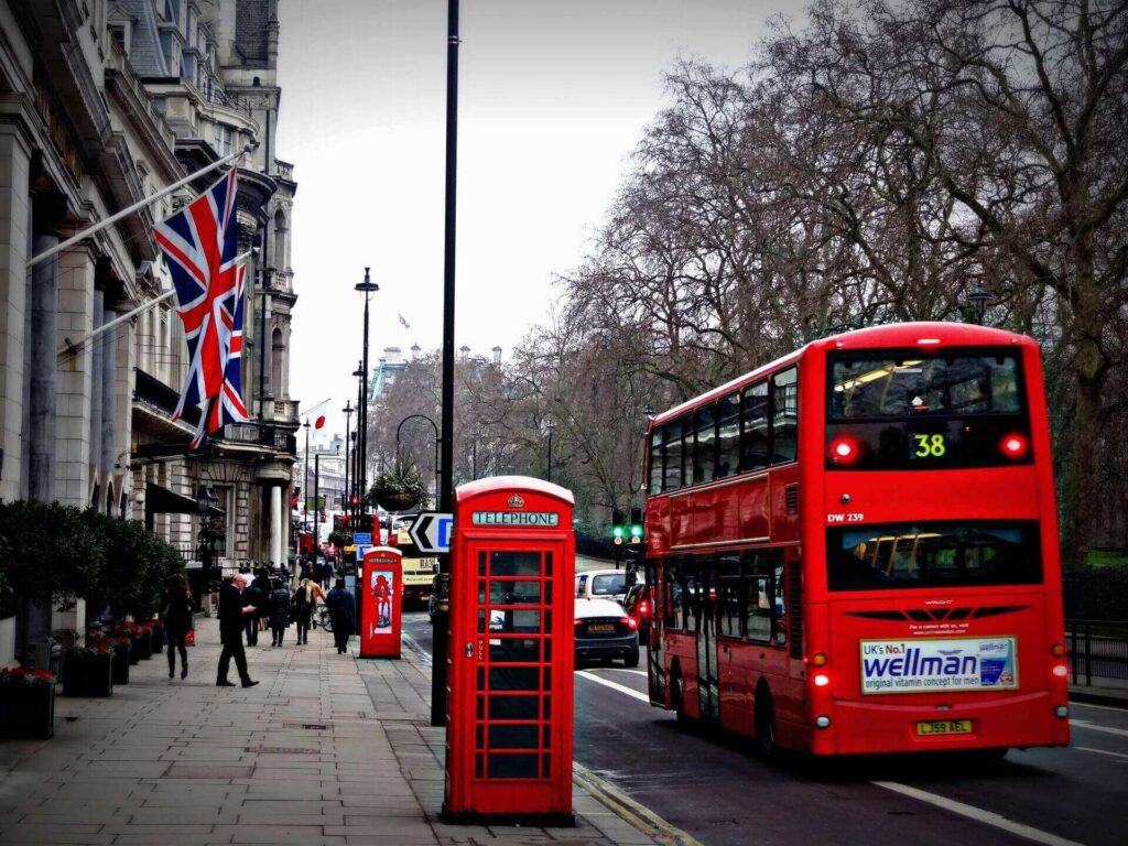 A red double-deck bus in the United Kingdom.