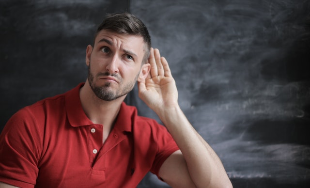 Man focusing to listen.