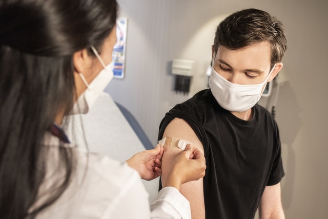 Guy getting his vaccination to study abroad amidst Covid-19.