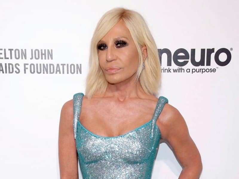 Donatella Versace breaking the bias at an award show with dazzling dress