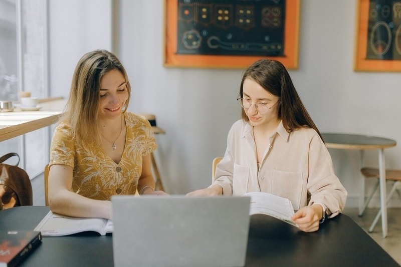 Study abroad consultant guiding student on applying to university.