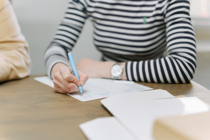 A girl writing on paper